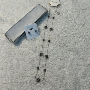 Trifari necklace with matching earrings. Black and silver.